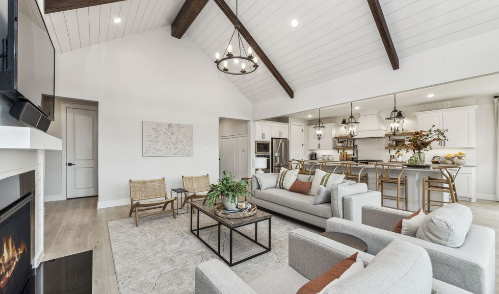 Great room with vaulted ceilings and stained ceiling beams