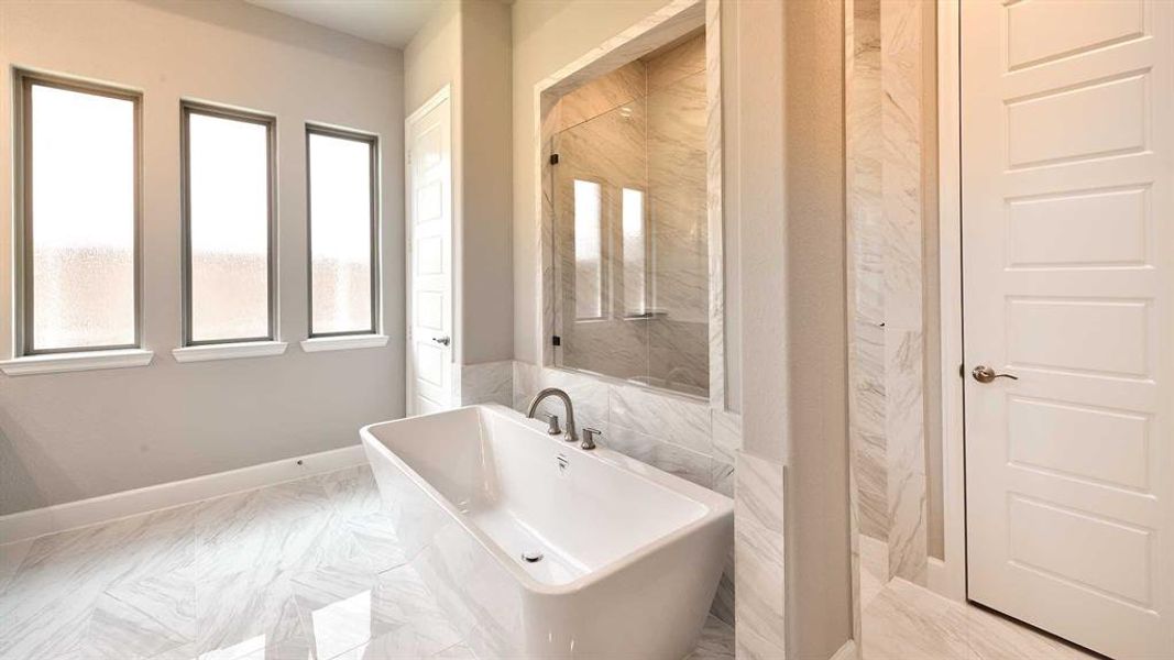 Bathroom featuring a bathtub and tile patterned floors