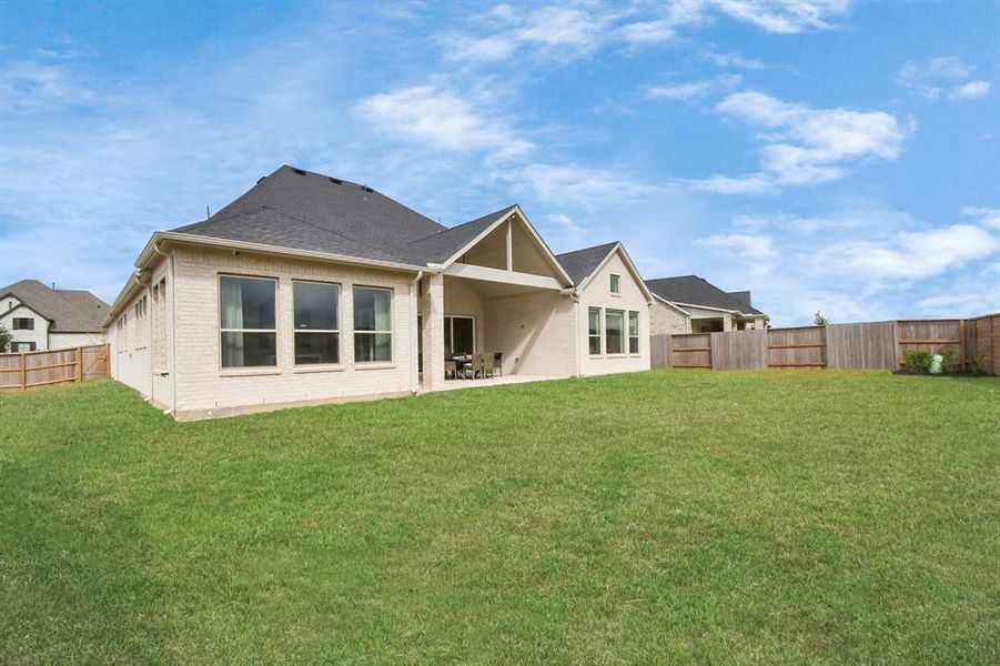 Expansive backyard with space for a pool, which is already plumbed and ready for your outdoor dream setup!