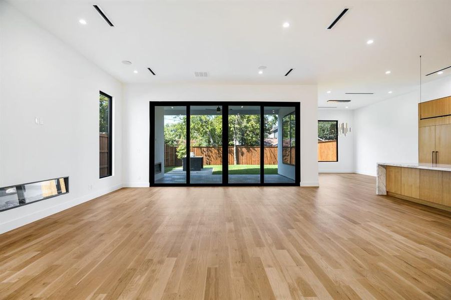 Unfurnished living room featuring light wood-type flooring