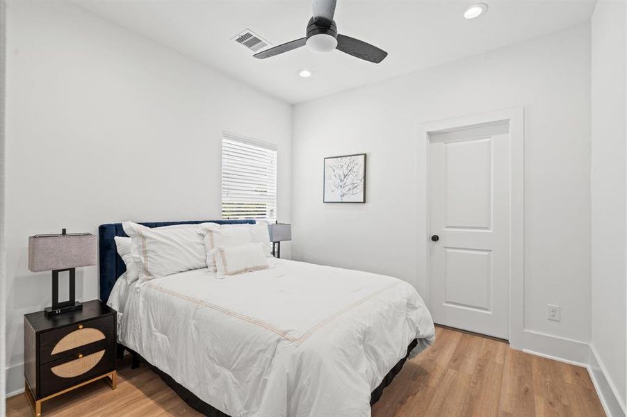 The secondary bedroom is conveniently housed on the third level and also features no carpet, an en-suite bathroom, and plenty of natural light! *All interior photos are from the model home: 5216 Pine Tree*
