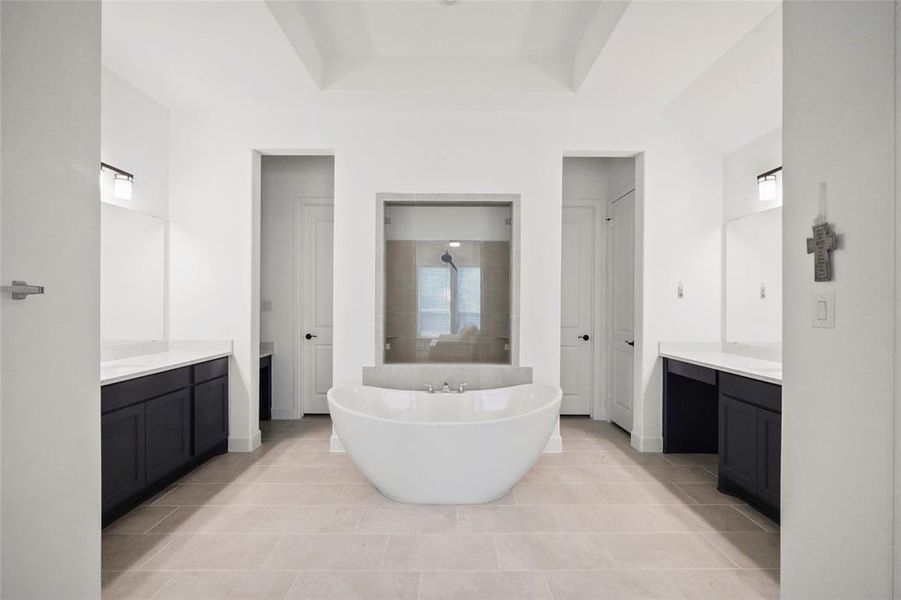 Look at the luxurious bathroom with his & her counter tops, a shower designed for two, enter on each side, 2 separate walk in closets and a deep soaking tub.