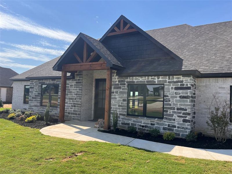 View of front of house with a front yard