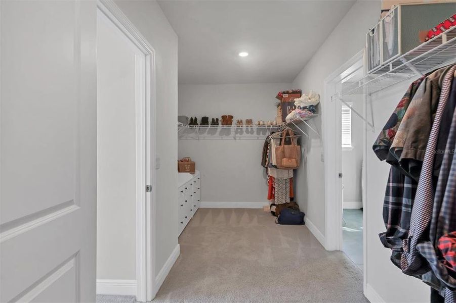 Large master walk in closet has access from both the master bedroom and to the second-floor laundry room!