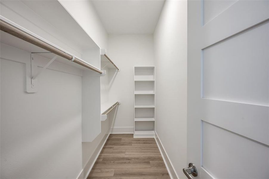 One of the two walk-in closets in the primary suite.