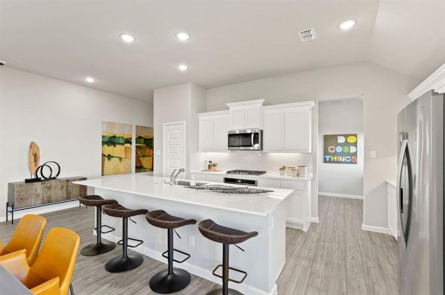 Kitchen in the Diamond home plan by Trophy Signature Homes – REPRESENTATIVE PHOTO