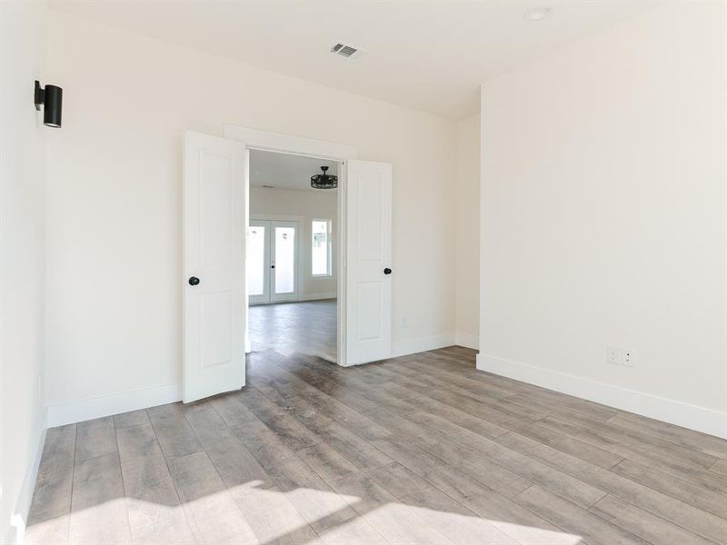 Spare room with light hardwood / wood-style floors