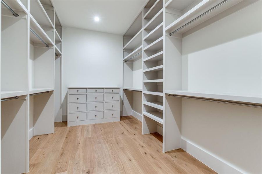 Walk in closet featuring light hardwood / wood-style floors