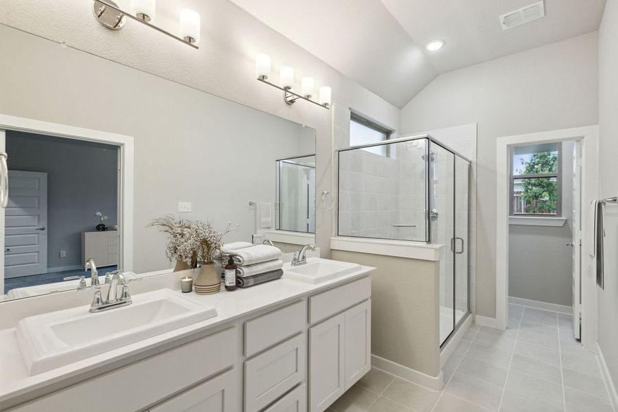 Primary Bathroom in the Claret home plan by Trophy Signature Homes – REPRESENTATIVE PHOTO