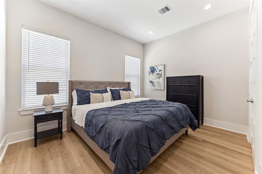 The secondary bedroom, pictured here with a king sized bed, is very spacious and has an en-suite bath.