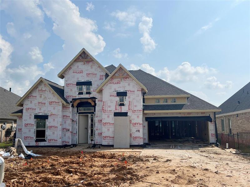 One-story home with 4 bedrooms, 3 baths and 3 car tandem garage