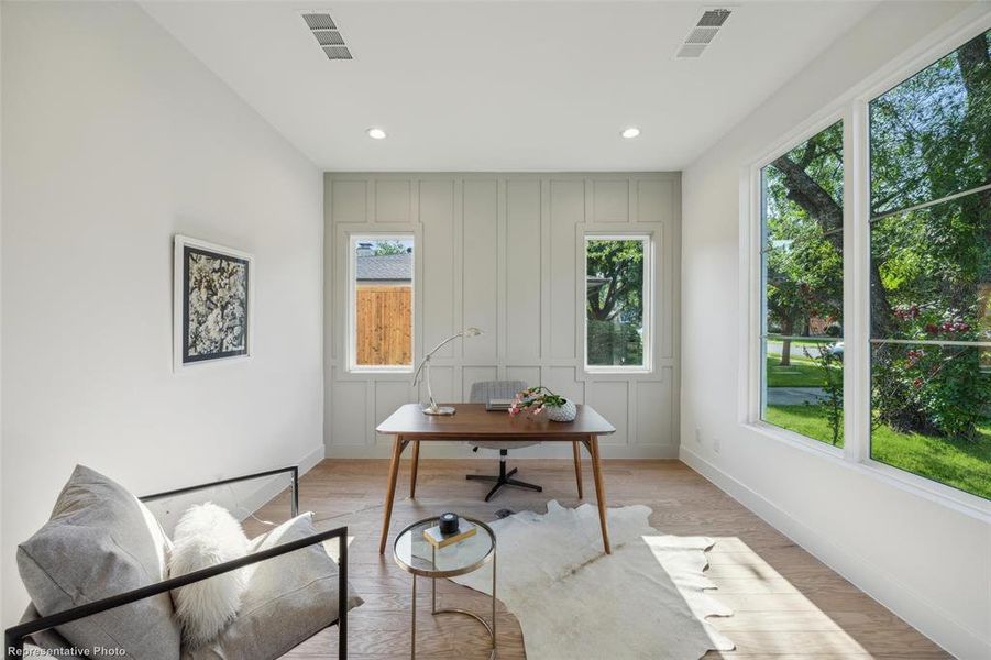 Office with french doors and accent wall on 1st level