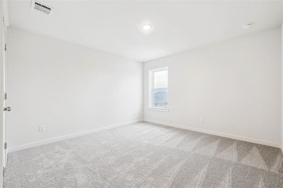 Empty room with carpet floors