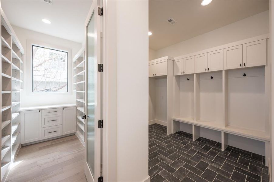 On the main level,you'll also find a large mudroom with storage cubbies and bench seating for efficient arrivals anddepartures.