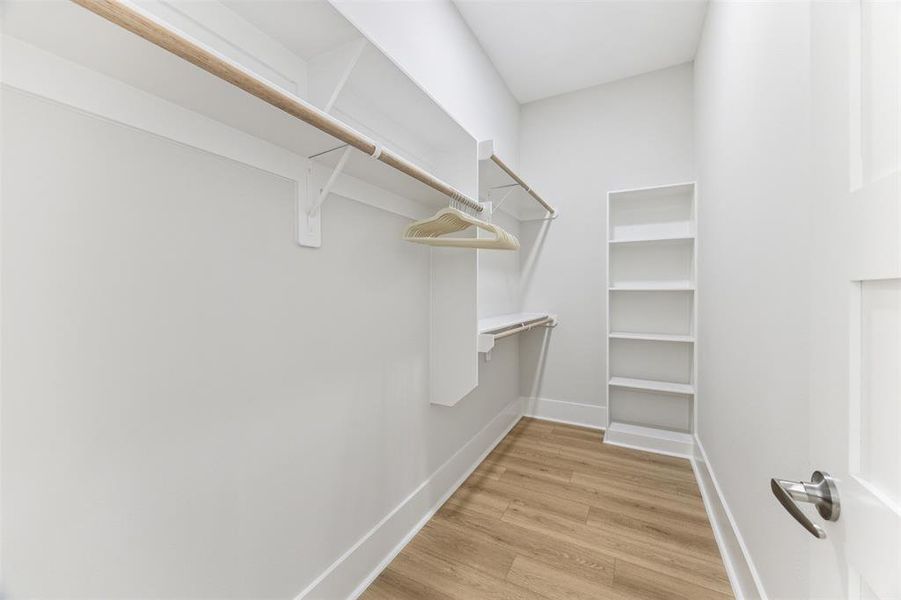 One of the two spacious walk in closets in the primary suite.