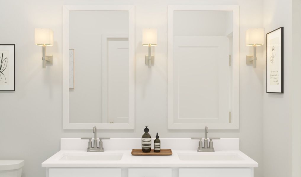 Primary bath with white-framed mirrors