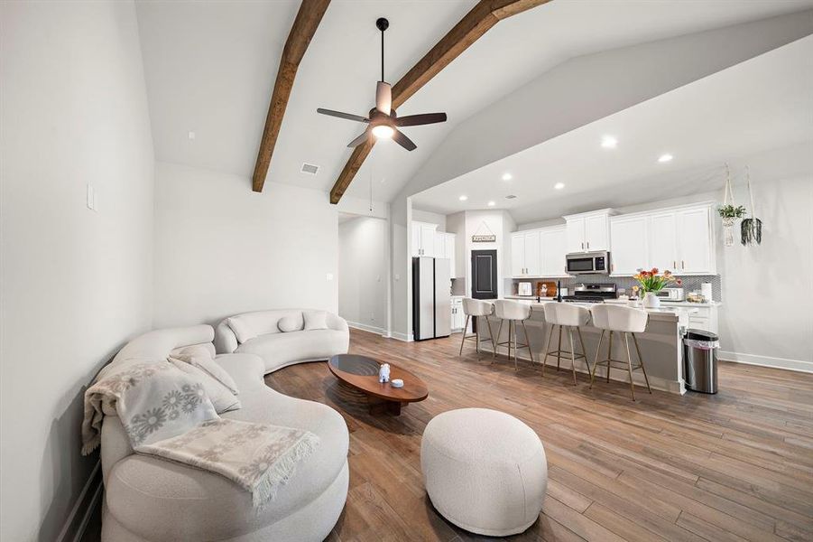 spacious living room with vaulted beams