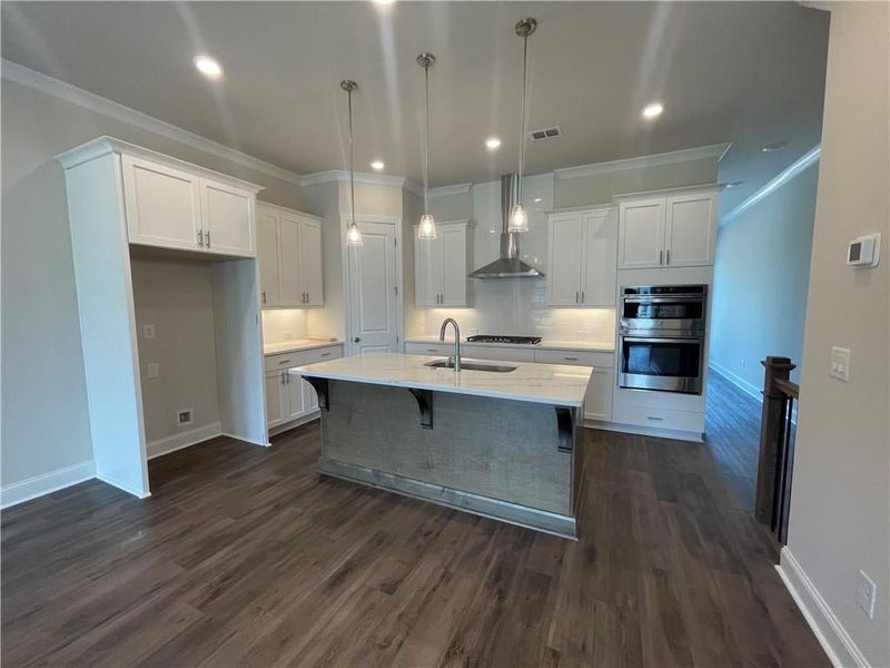 One the second floor you transition to this amazing Kitchen with  beautiful white shaker cabinets that give you that fresh appeal.