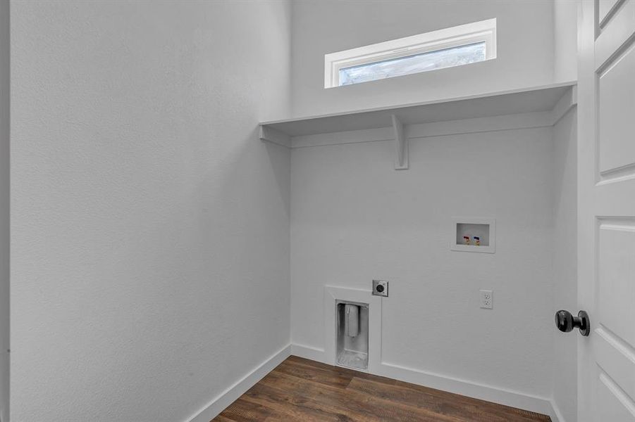 Washroom with dark wood-type flooring, washer hookup, and electric dryer hookup