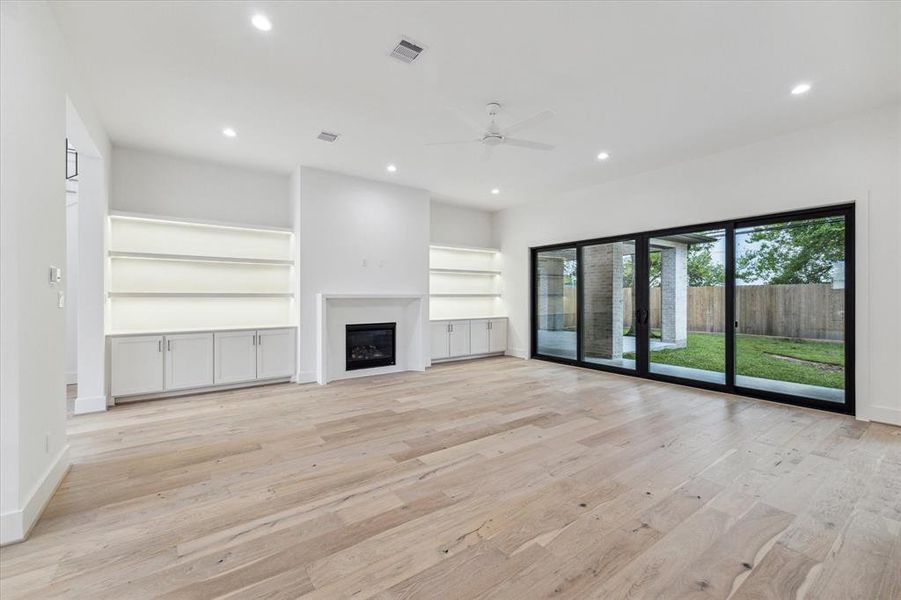 Family Room - Built in display shelves feature Phantom Lighting