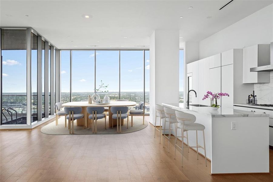 Residences at the Allen Penthouse features 12 ft ceilings, Gaggenaua appliances, Pedini Italian cabinets, porcelain counter tops and back splashes.  This particular residences offers additional cabinetry, wine refigerato plus space for possible wine roo,  pantry and or a second kitchen.