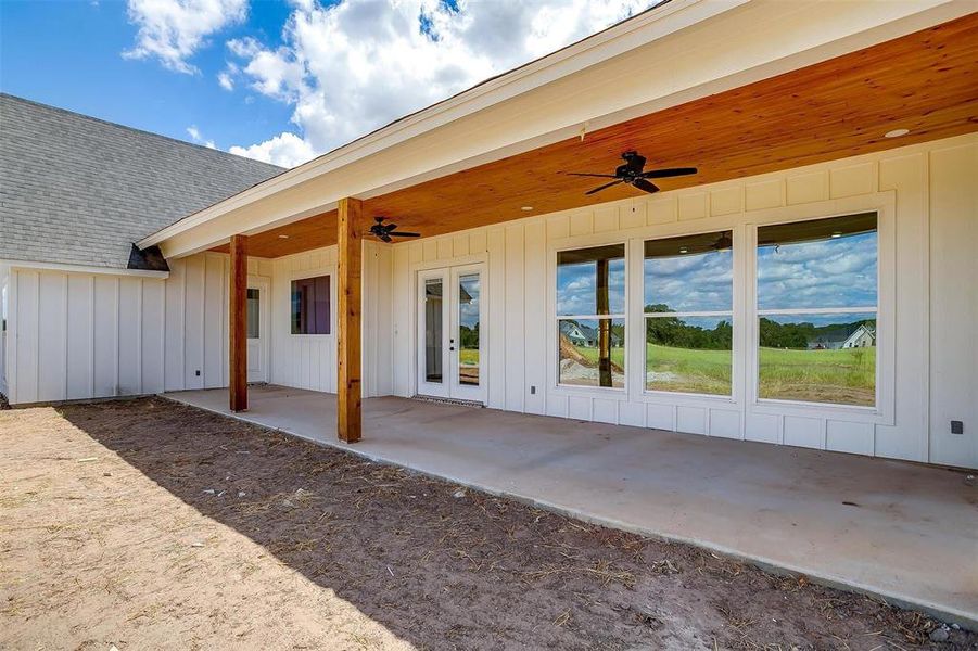 View of patio with french doors and ceiling fan