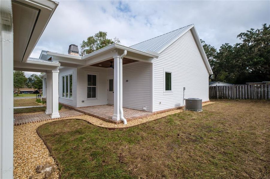 Details and surprises like a second porch area and the unique design of this covered walkway joining the home and garage are just a few more features you will come to love.