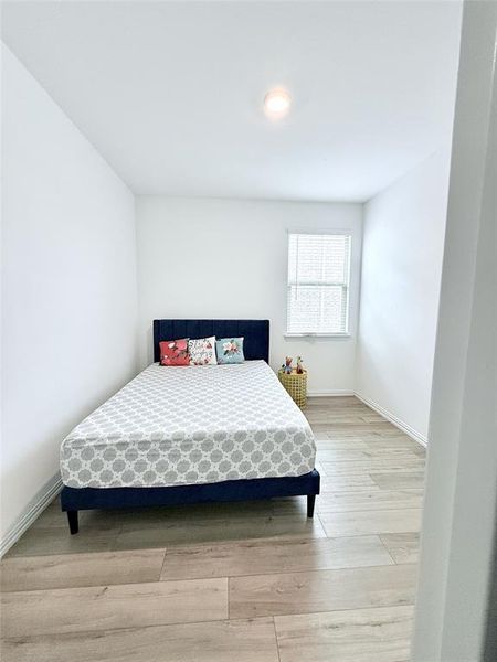 Bedroom with light wood-type flooring