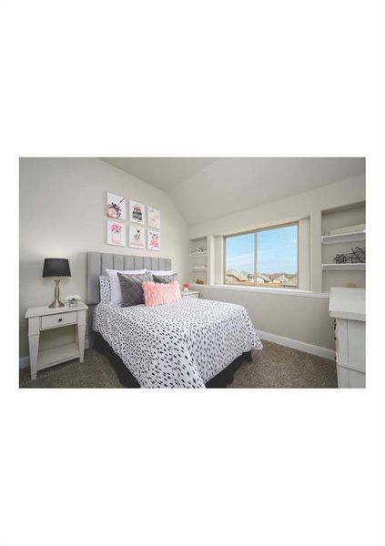 Carpeted bedroom featuring lofted ceiling