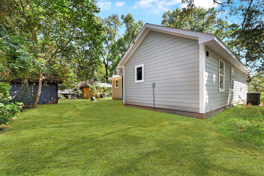 Picture of the back of the home.  Again, grass has been added for the pictures, but sod is being put in.