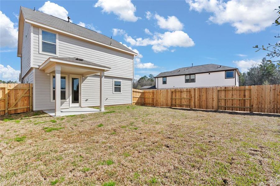 Come and see this spacious backyard with its beautiful covered patio. There is plenty of room for the kids to play and adults to relax! Perfect for your outdoor living space, patio furniture, bbq pit, and so much more. The possibilities are endless!