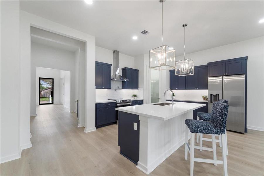 Quartz countertops, Midnight blue soft close cabinets, stainless steel appliances, Undermount cabinet lighting, walk in pantry, pre wired for home security, entertainment, internet,ceiling accent lighting.