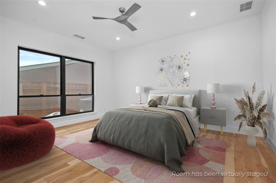 Bedroom featuring ceiling fan and hardwood / wood-style floors