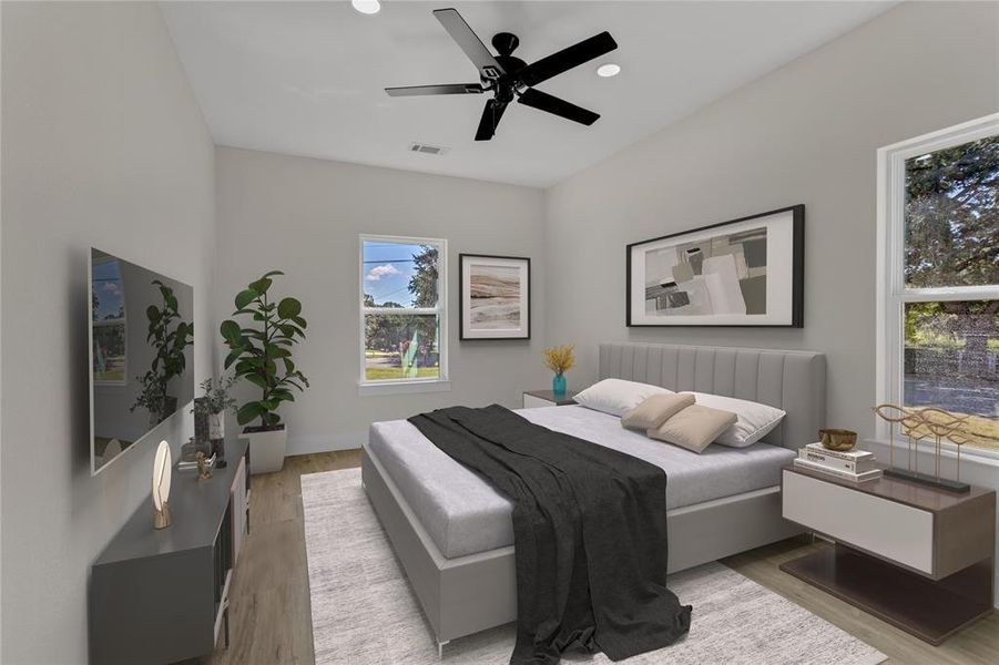 Bedroom featuring ceiling fan and light wood-type flooring