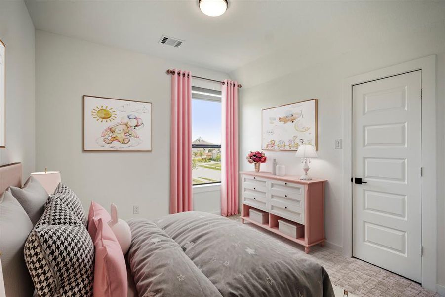 This spacious secondary bedroom features bright natural light, plush carpet, and a walk-in closet. *This room has been virtually staged