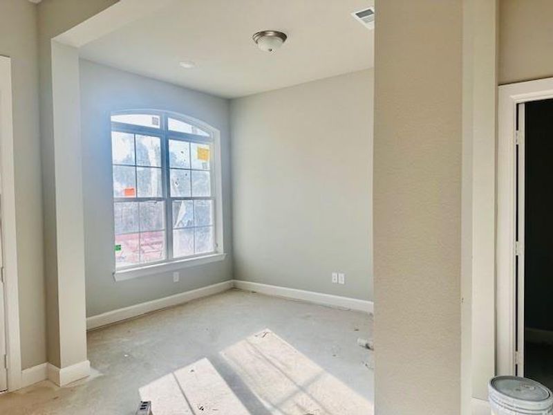 Open Study with big windows, 10 ft ceilings and vinyl plank floors