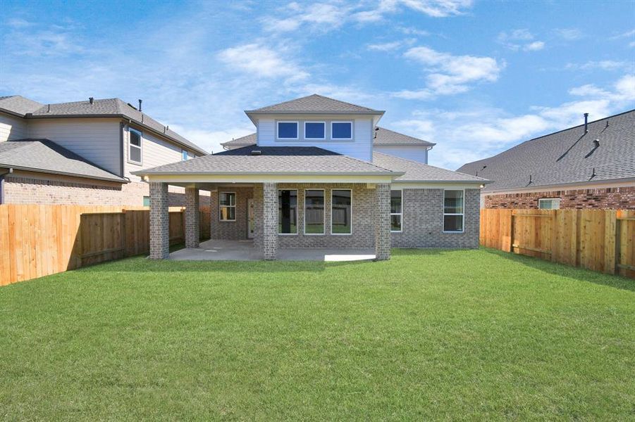 Experience outdoor living at its finest on this expansive covered patio, thoughtfully designed for BBQs and delightful outdoor dining.