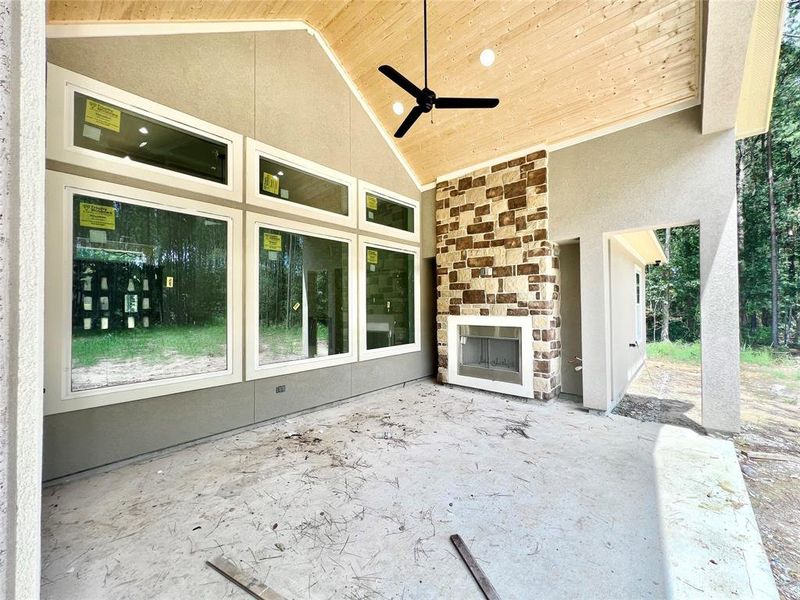 LARGE BACK COVERED PATION WITH BEAUTIFUL WALL-SIZE WINDOWS & OUTDOOR FIREPLACE.