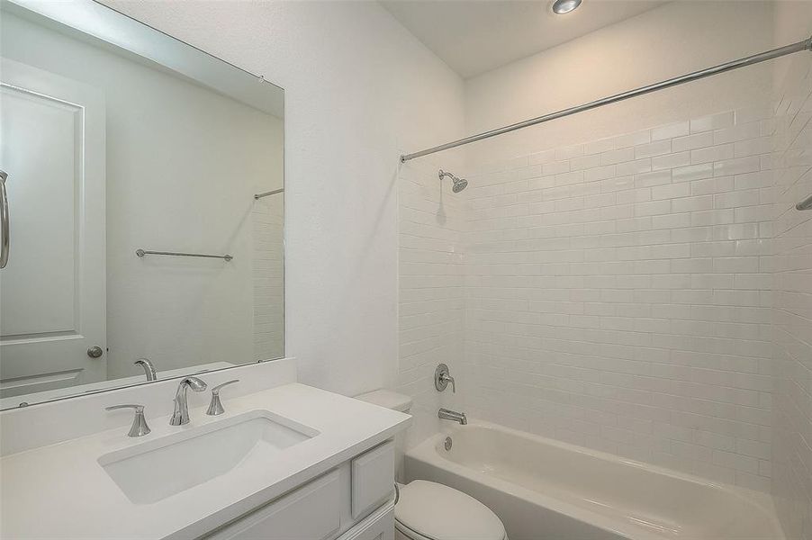 Previous secondary bedroom has its own bathroom, shower-tub combo.