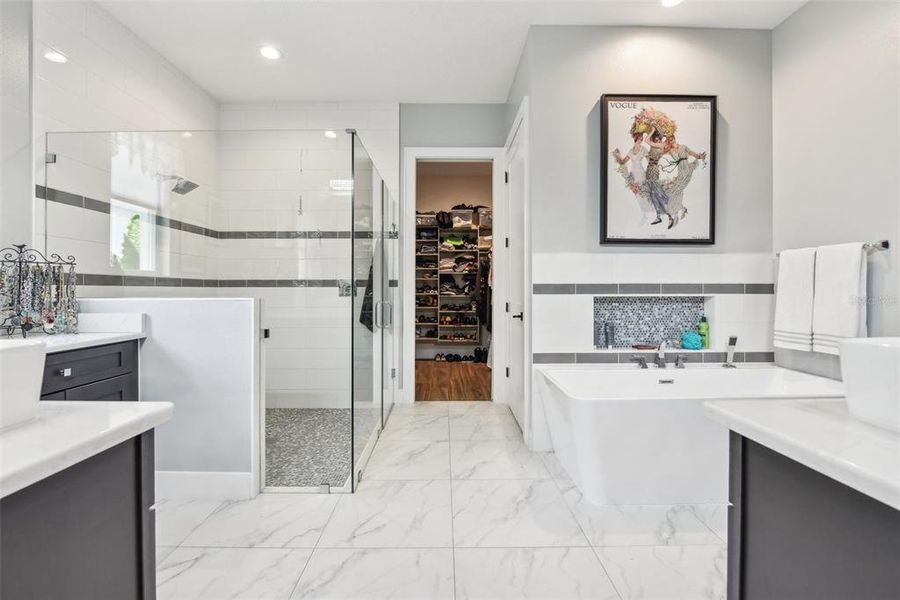 Primary Bath with Walk-in Shower and Garden Tub connects to Walk-in Closet