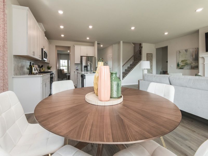 Gather the family around the dining table, at the heart of the open-concept living area.