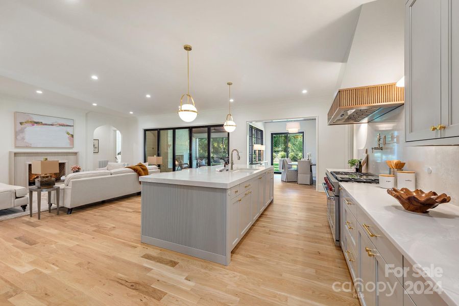 Amazing kitchen with large island and hand crafted hood.