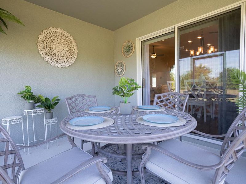 Enjoy the gorgeous Florida weather on your covered lanai with optional screening - Raychel home plan by Highland Homes