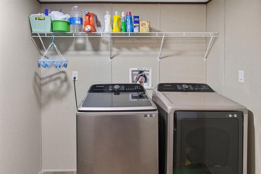 Positioned just off the kitchen, the Laundry Closet features both a washer and dryer, making laundry day a breeze. The open layout ensures easy access while keeping household chores out of sight.