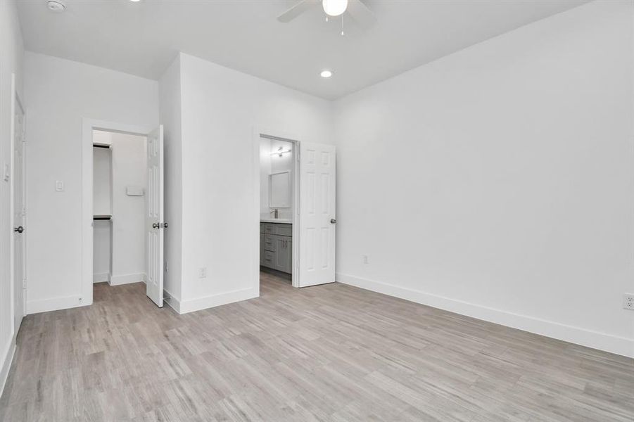 Primary bedroom with walk in closet.