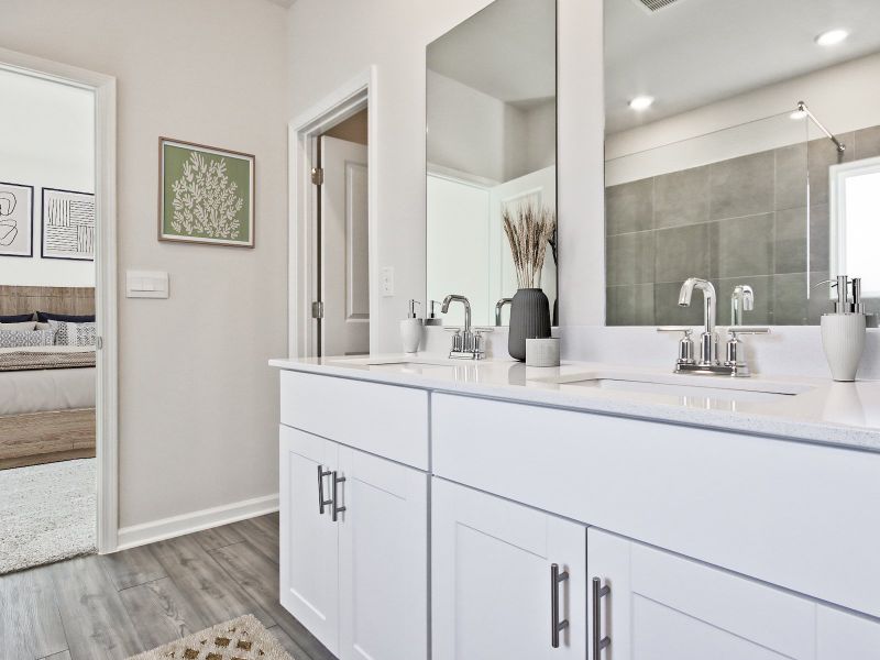 The private ensuite boasts dual sinks and a large walk-in closet.