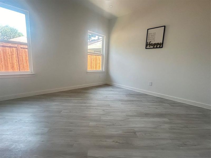 Spare room featuring hardwood / wood-style flooring