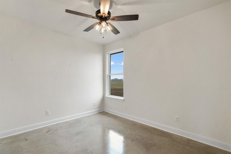 Unfurnished room featuring ceiling fan