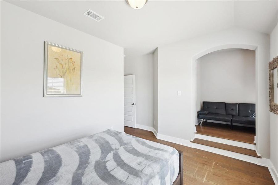 Bedroom featuring dark hardwood / wood-style floors