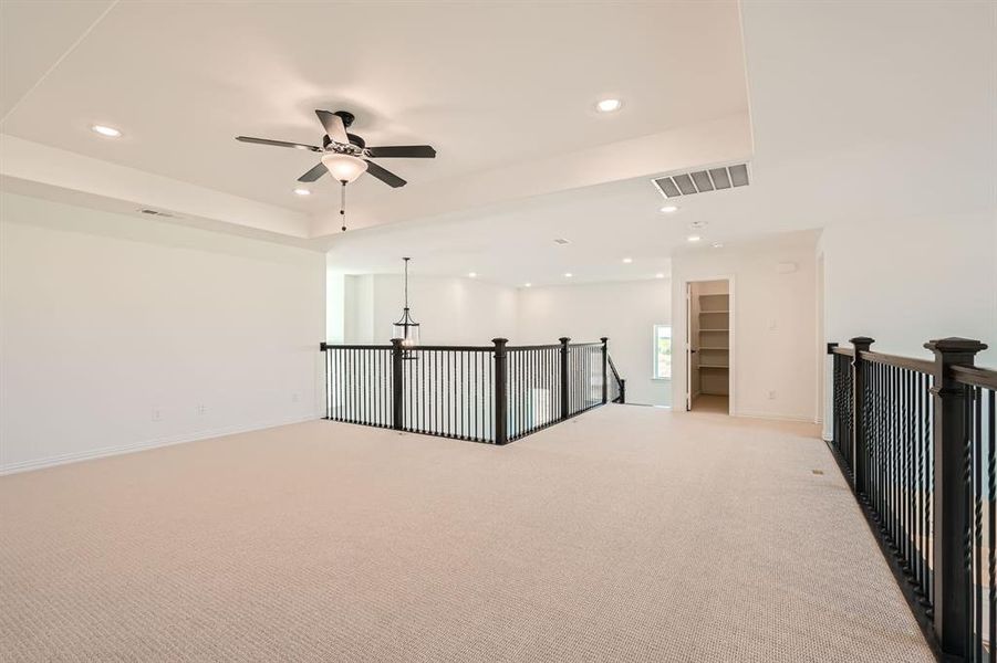 Unfurnished room with light carpet and ceiling fan